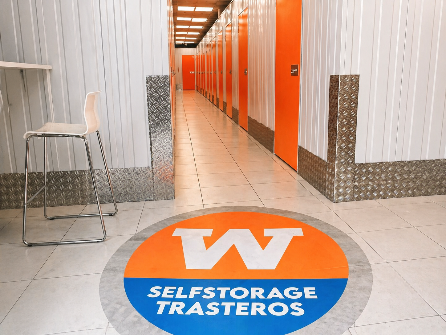 Interior hallway of WARDA with logo on the floor